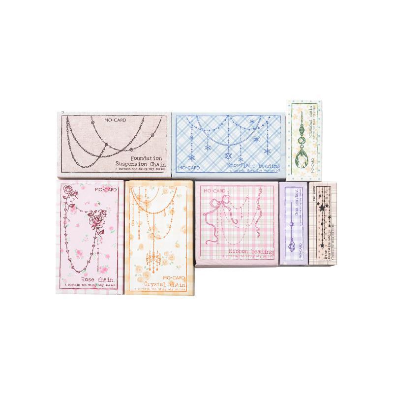 A Curtain of Stars stamp gift boxes in eight colors – chain, bead and gem designs, one beech stamp per box