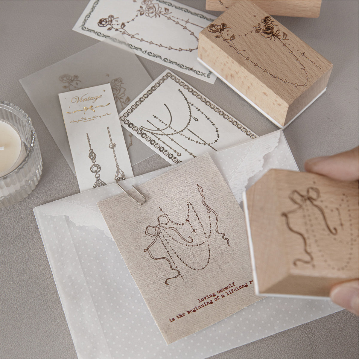 Stamped impressions from Curtain of Stars wood stamps – delicate chain and bead borders in ink on paper