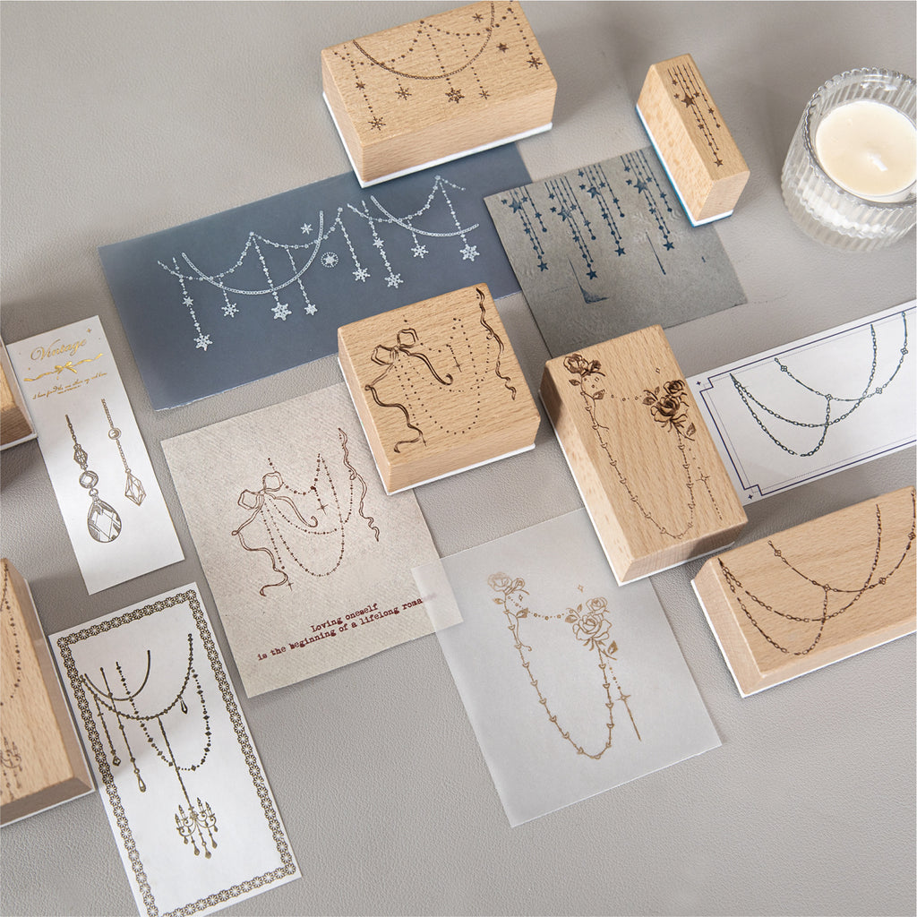 Curtain of Stars wooden stamps scattered with stamped impressions – jewelry chain border designs in beech wood
