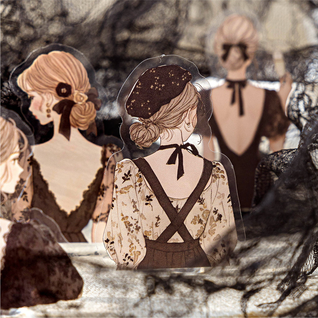Close-up of a transparent PET girl silhouette sticker wearing a beret, displayed against black lace. Perfect for dark academia and gothic vintage scrapbook layering.