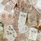 Warm brown earth tone embossed botanical paper stickers scattered vintage journal ephemera