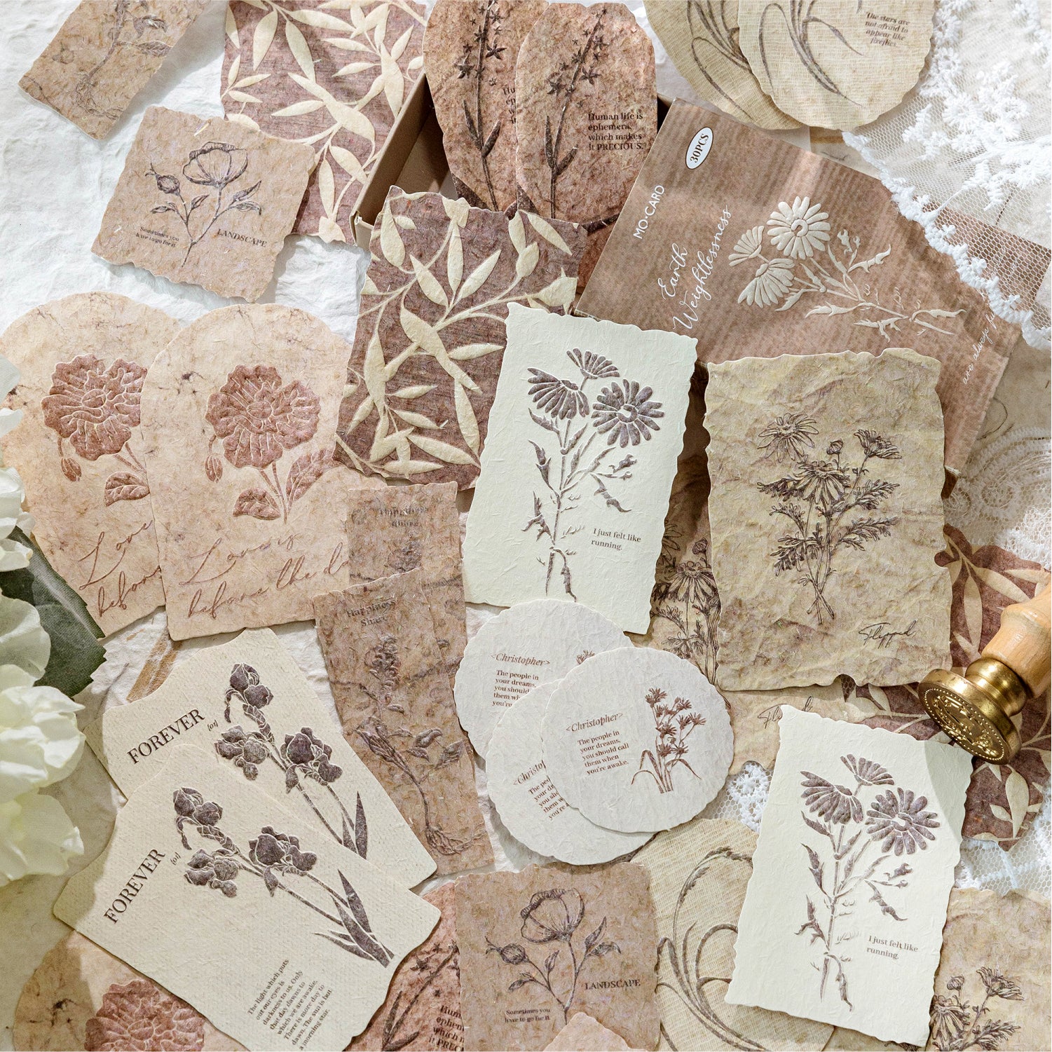 Warm brown earth tone embossed botanical paper stickers scattered vintage journal ephemera
