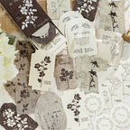 Light green botanical embossed paper stickers scattered vintage journal ephemera