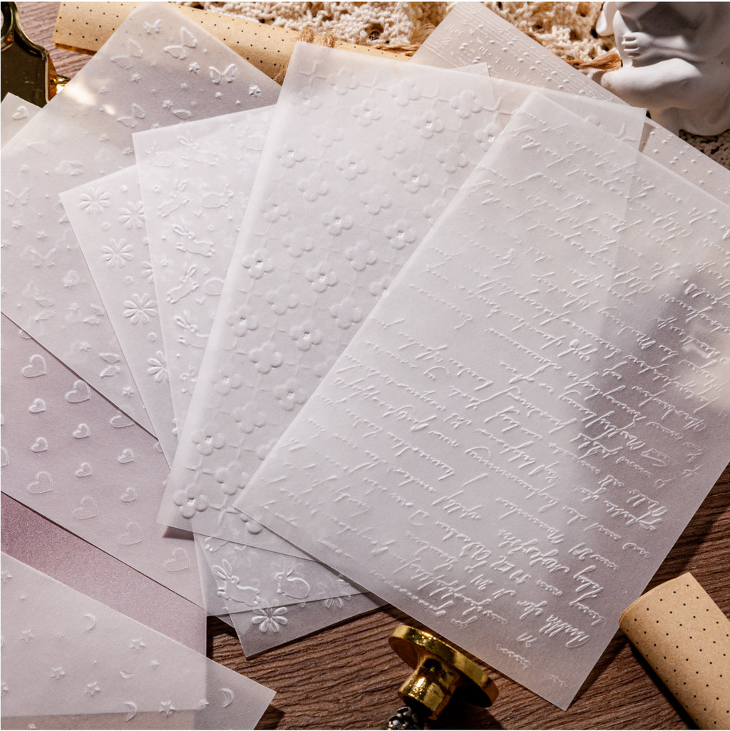 Green-toned embossed vellum paper with leaf relief texture for translucent journal overlays
