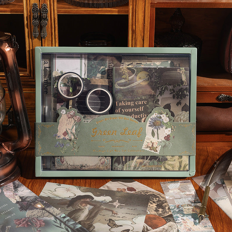 Emerald Manor green aesthetic junk journal kit, a forest fae themed gift box with botanical stickers and vintage paper.