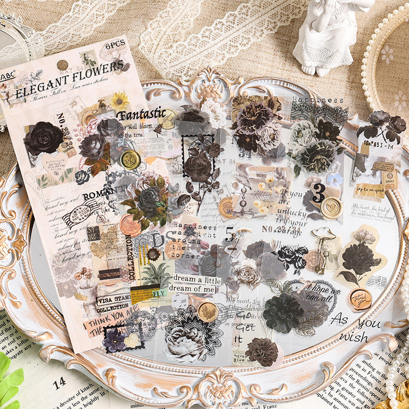 Dark-toned floral stickers from the Falling Blossoms collection arranged on a ceramic tray – moody vintage journaling supplies