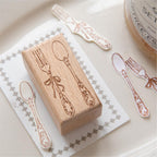 Beech wood stamp beside its stamped impression – laser engraved design on natural wood