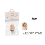 Star hand-drawn wooden stamp, beech wood handle with five-point rubber face for celestial journaling spreads.