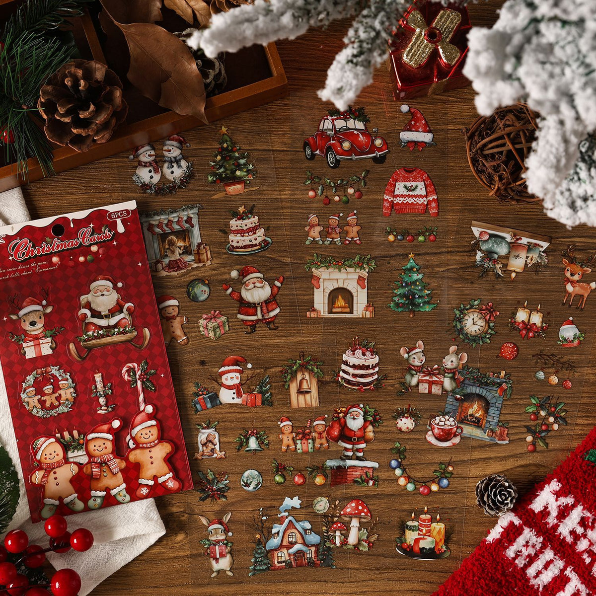 Golden Bell Gallery stickers spread on kraft paper with a red ribbon