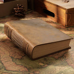 Hand-stitched crazy horse leather sketchbook with cord-bound spine on vintage map
