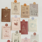 Vintage textured journal cards pinned on white wall with round stickers mood board decor inspiration
