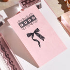 lace reverie bow acrylic stamp standing on pink box clear vintage stamp