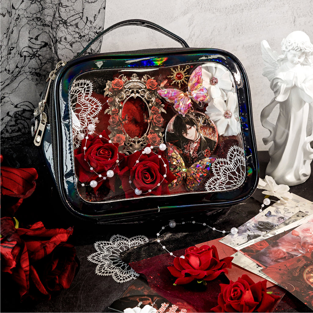 Gothic and romantic Ita bag decoration using the Midnight Rose mixed media kit. The clear window is styled with dark red 3D roses, white lace paper, a baroque laser-cut frame, anime pins, and holographic butterflies.
