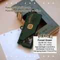 Forest green portable 6-hole planner punch, compact plastic body with metal pins and built-in alignment guide.