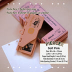 Soft pink portable 6-hole planner punch, compact plastic body with alignment ruler for ring journals.