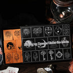 The aesthetic packaging of the Picking up Dreams Under the Moon stamp set, partially opened to reveal the wood stamps inside. Styled with an antique lantern and a vintage pocket watch.