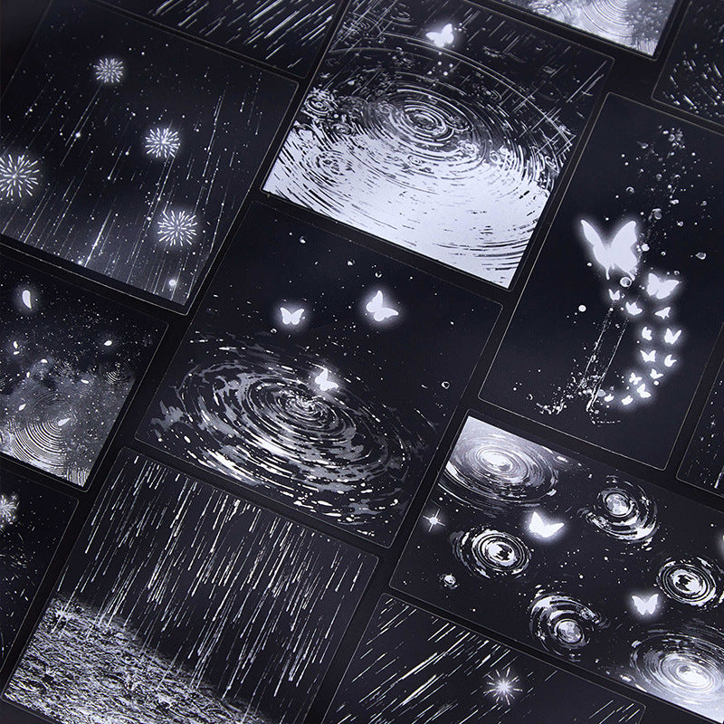 Close-up of water ripple raindrop and butterfly PET transparent stickers on black background for mood journal layering