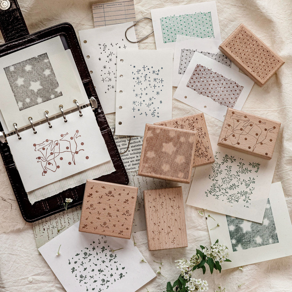 Complete set of romantic background stamps with mixed impressions on collage papers, floral star and lace textures.