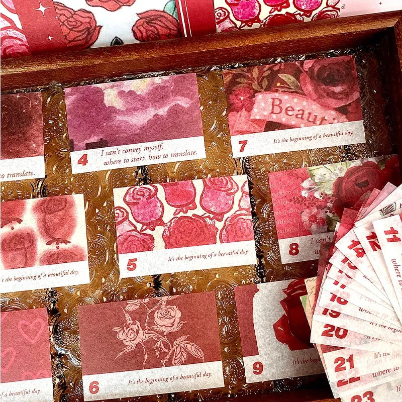 A close-up photograph of a variety of romantic rose-themed washi sticker strips, foldable memos, and ephemera cards from the Symphony of Rose journal kit, featuring detailed floral patterns, vintage typography, and postage stamp designs, perfect for aesthetic layering in junk journals.