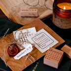 vintage journaling desk with stamped calendar pages and candle time travel stamp set