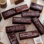collage memory wooden stamp collection dark wood handles white printed designs vintage journaling