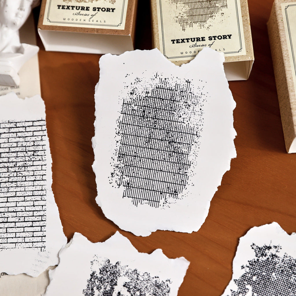 texture story stamp impressions on deckle edge paper stone and text patterns