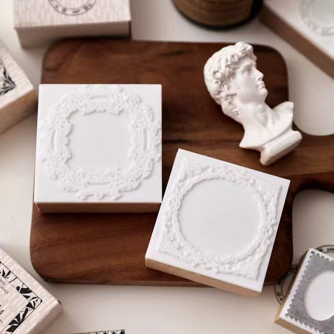 whispers of the border stamp boxes styled on wooden board vintage stationery scene