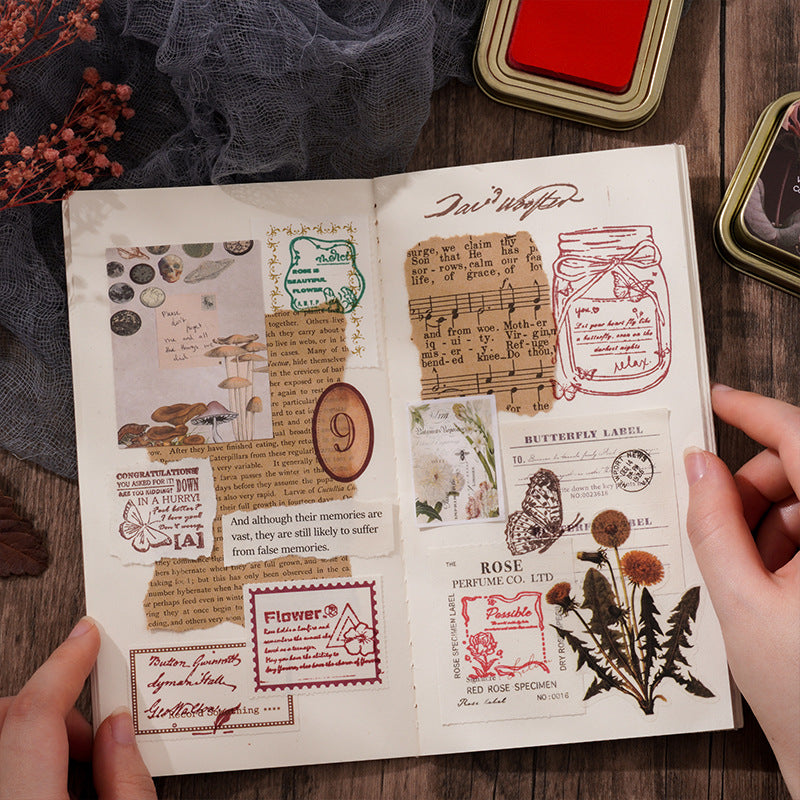 Junk journal spread collaged with stamped labels, music sheets and botanicals