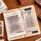 texture story wooden stamps in open journal vintage background stamping setup