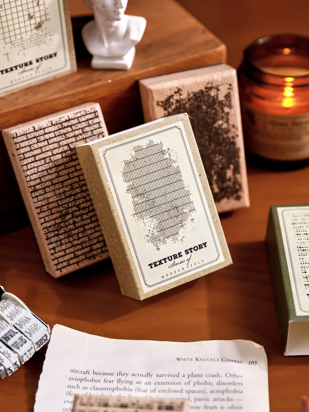 three texture wooden stamps on wooden board candlelight vintage stationery scene