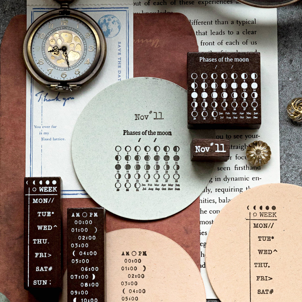 Creative junk journal layering using the celestial stamp set. Features crisp sunburst and moon phase impressions on torn edges of kraft paper and vintage book pages, styled beautifully with a bronze pocket watch.