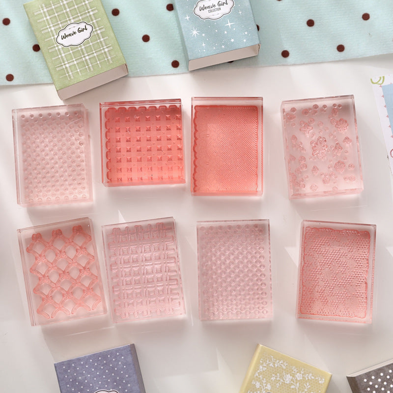 Textured acrylic stamp blocks flat lay – clear patterned stamping surfaces in pink and blush tones