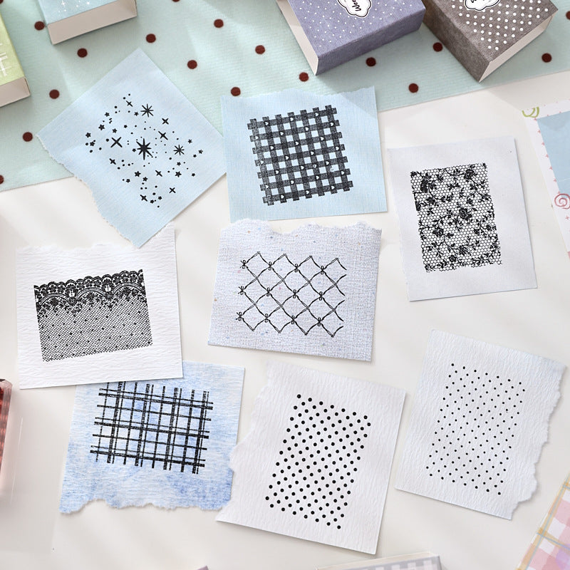 Stamped pattern impressions from textured acrylic stamps – hearts, gingham, crosshatch and polka dots in ink on paper