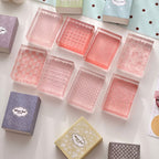 Textured acrylic stamp blocks viewed from above – transparent stamps with woven dot and check patterns
