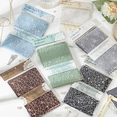 Six packs of mixed-texture specialty paper in dusty blue, sage, slate, cocoa, and noir tones for junk journal layering