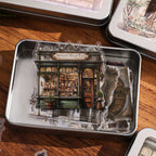 Open travelogue sticker tin showing European street scene PET stickers – die-cut cityscape designs in a reusable tin
