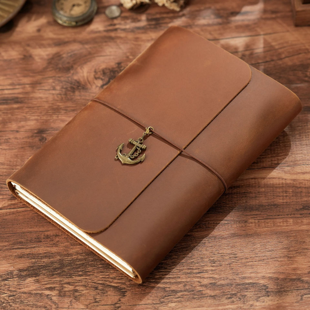 Brown A5 trifold leather journal with elastic cord and brass anchor charm