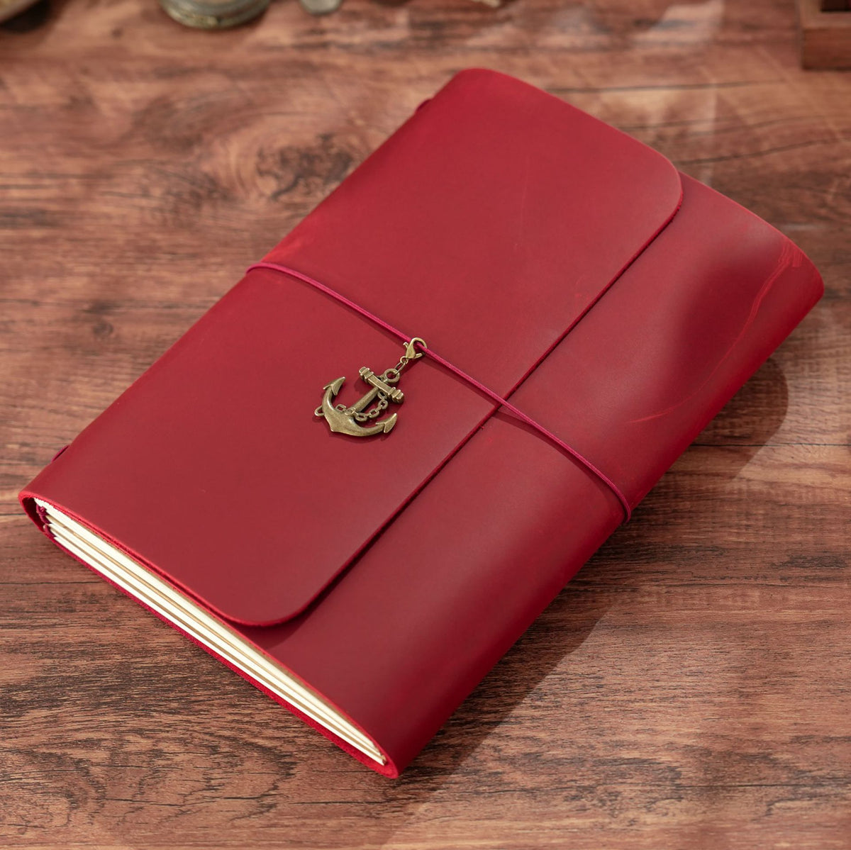 Wine red A5 trifold leather notebook with elastic wrap closure