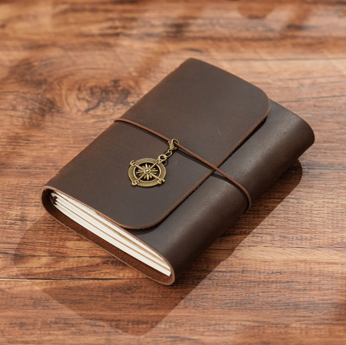 Coffee brown trifold leather notebook with vintage brass compass detail