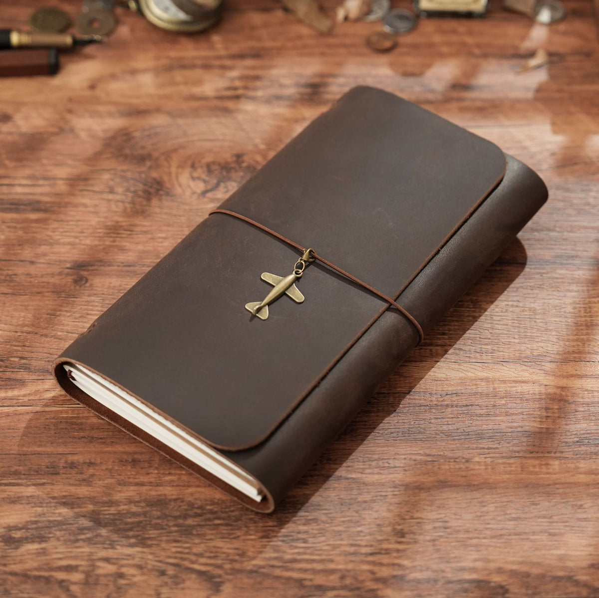 Coffee brown trifold leather notebook with vintage brass charm detail