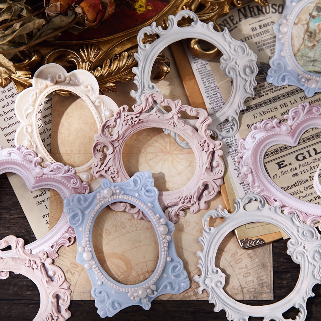 Vintage journal spread with 3D embossed frames layered over butterfly stickers and floral ephemera