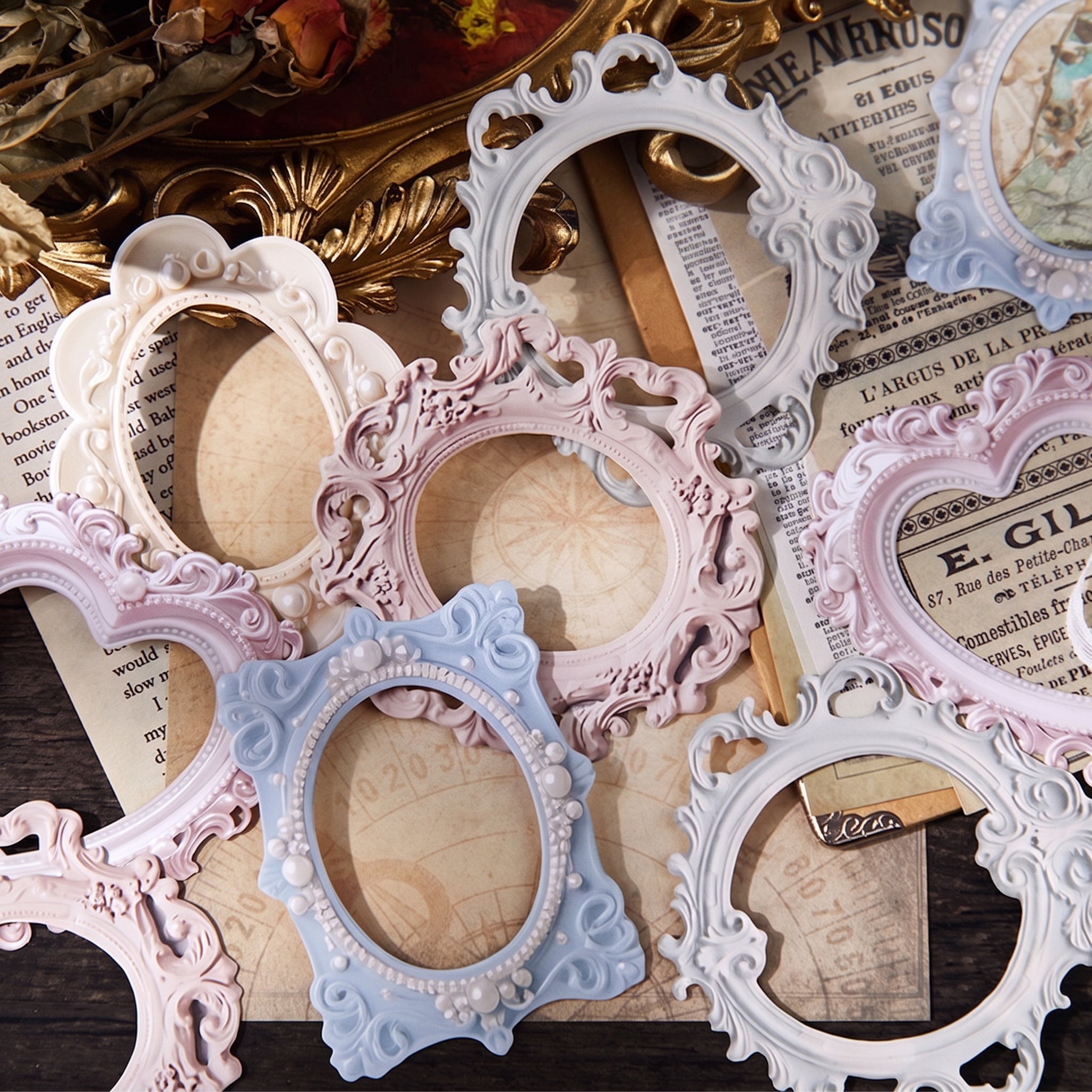 Vintage journal spread with 3D embossed frames layered over butterfly stickers and floral ephemera