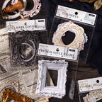 Six style 3D embossed frame sticker packs displayed on dark wood with candle and mannequin hand