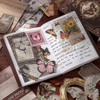 An open vintage notebook showcasing a beautifully layered junk journal spread. The pages are decorated with pink translucent butterfly PET stickers, vintage text papers, and botanical ephemera, surrounded by aesthetic scrapbooking supplies on a desk.