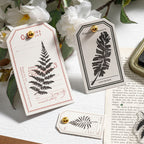 Kraft gift tags stamped with fern designs using vintage botanical clear stamps