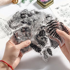 Hand holding transparent silicone clear stamp sheets – raised vintage designs on soft flexible silicone