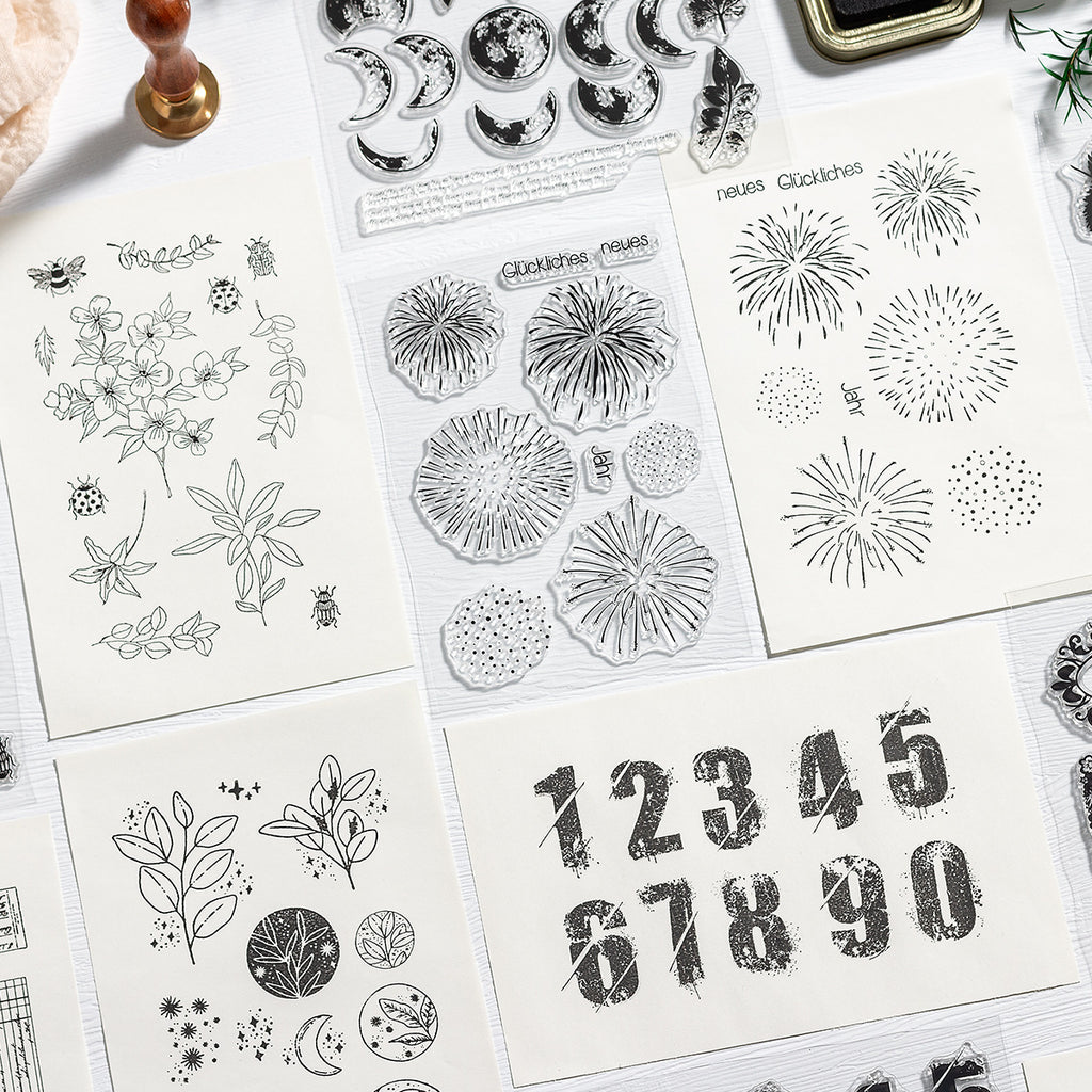 Vintage numbers and snowflake clear stamp sheets with stamped digits 12345 on paper