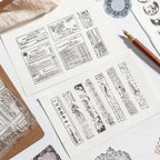 Clear stamping workspace – silicone stamp sheet, ink pads and stamped journal pages in progress
