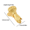 A detailed close-up of the vintage gold metal journal clip featuring a small hand (no pearl detail) holding a rose bouquet. A visible rhinestone ring is on the index finger, clamping textured aged paper. Perfect for Dark Academia journaling.