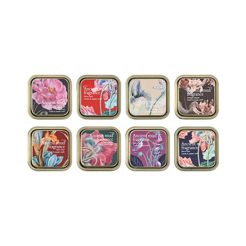 Complete set of 8 floral-lid ink tins on white background